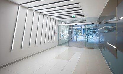 Find out more about our Building Consultancy services - image shows a modern building with unique shaped strip lighting